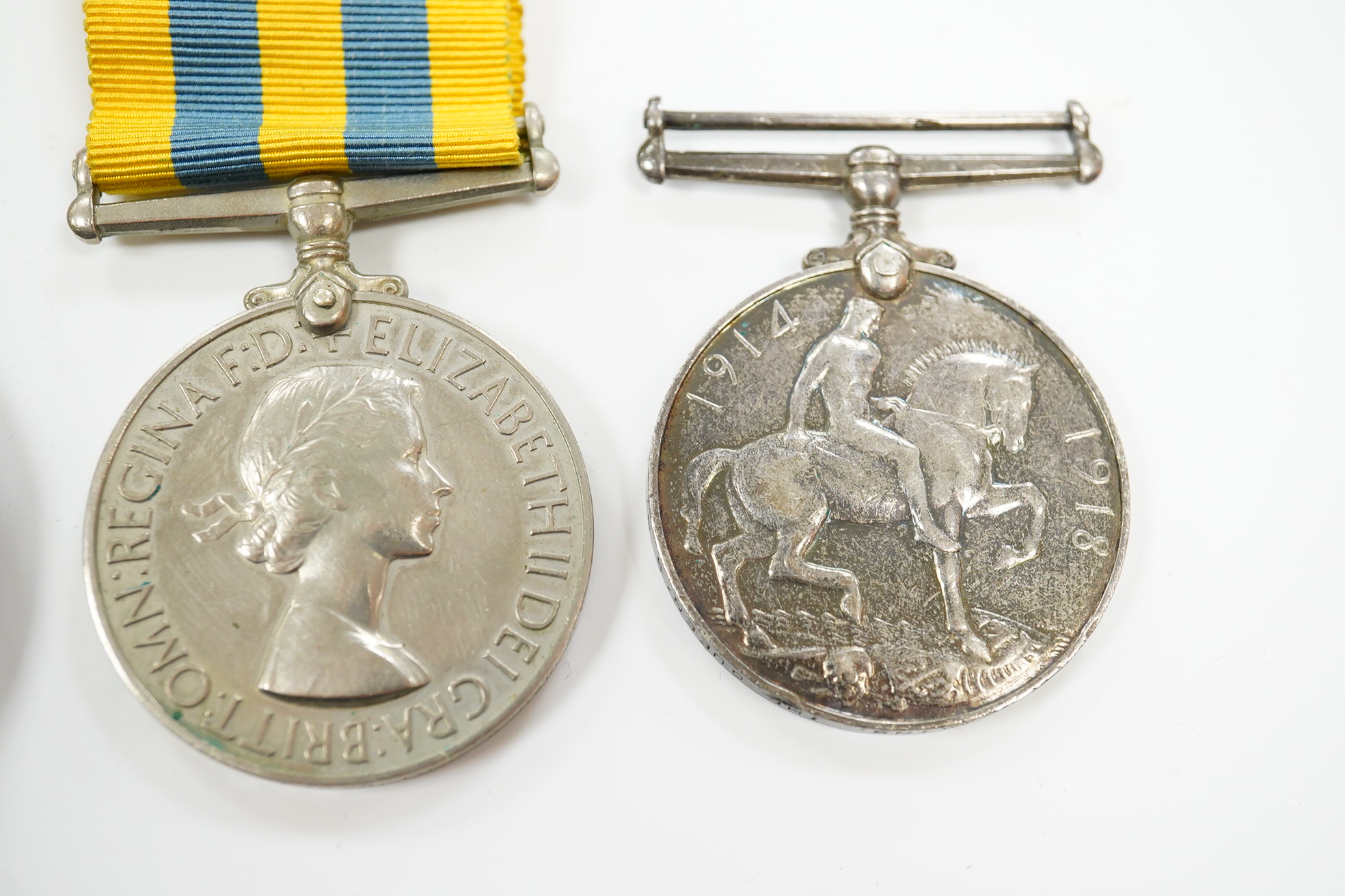 A First World War medal pair awarded to SJT. F.C. Howkins, The Queen’s R., together with a QEII Korea medal pair awarded to CPL. T.A. Howkins, R. Norfolk, plus a Lusitania propaganda medallion, all contained in a Princes